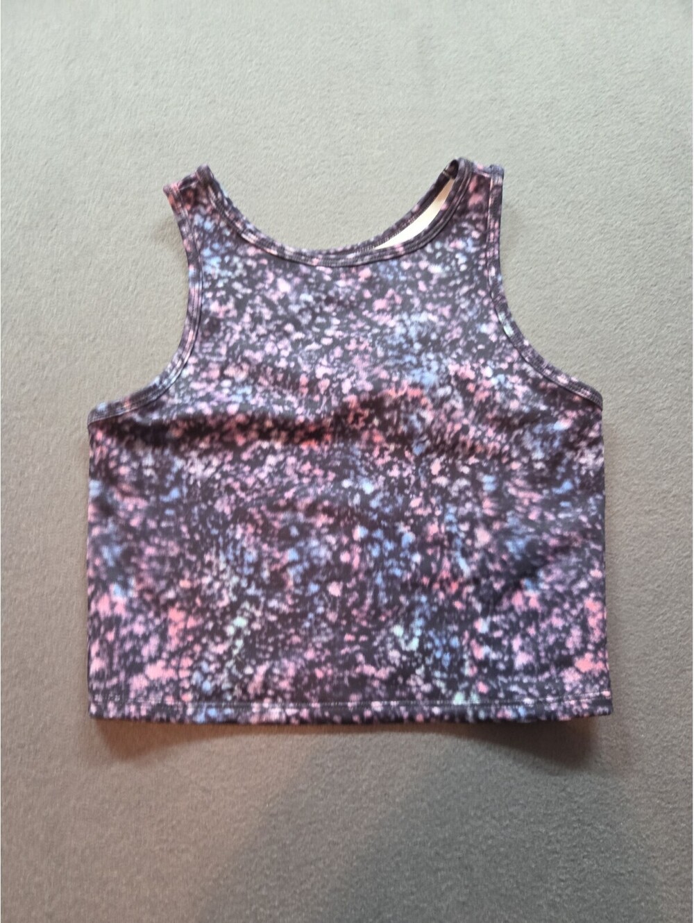 girl's Zella tank crop top features a colorful pink and blue tie-dye pattern